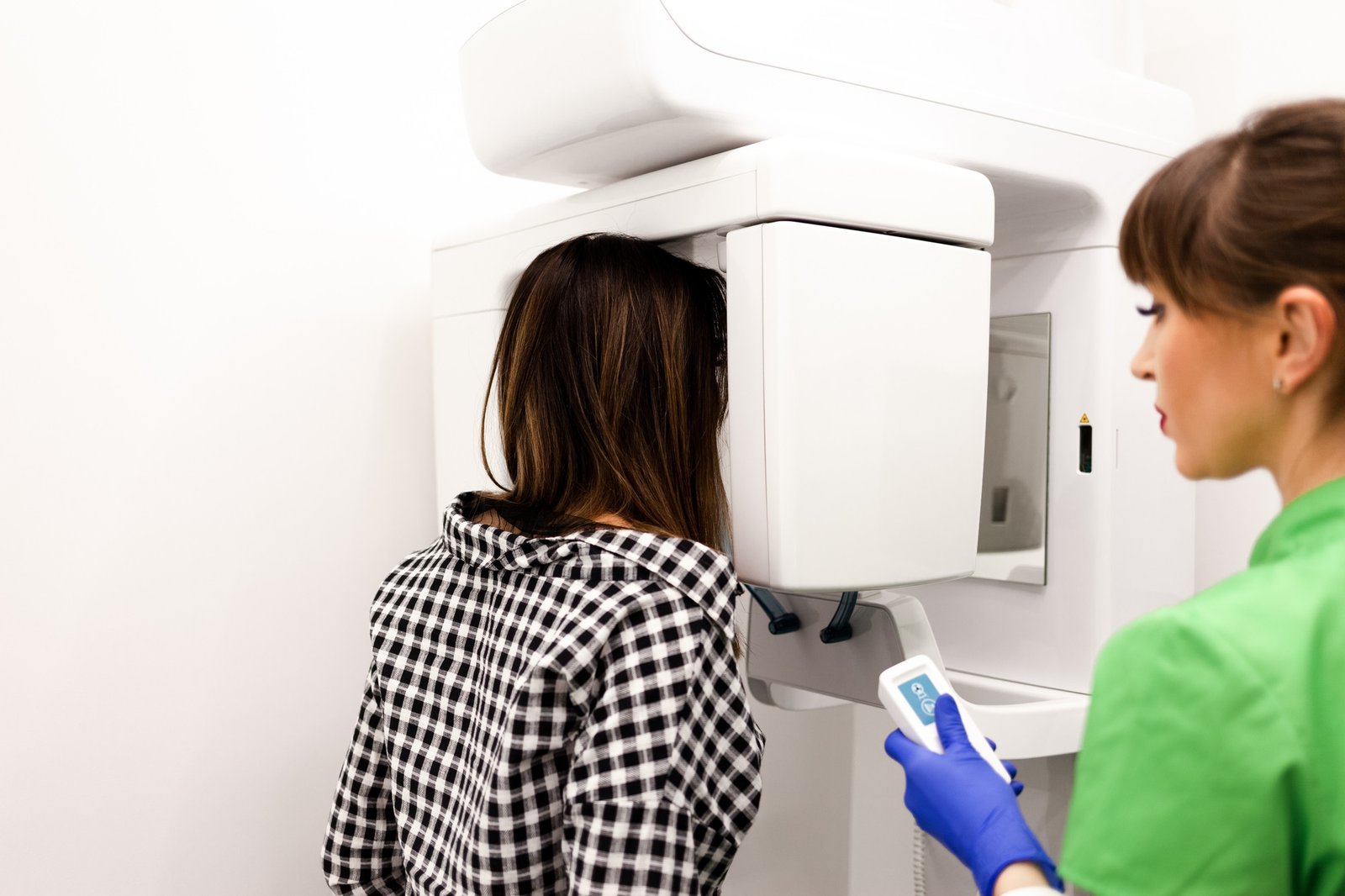 Dentist doctor does the patient a panoramic x-ray of the oral cavity.