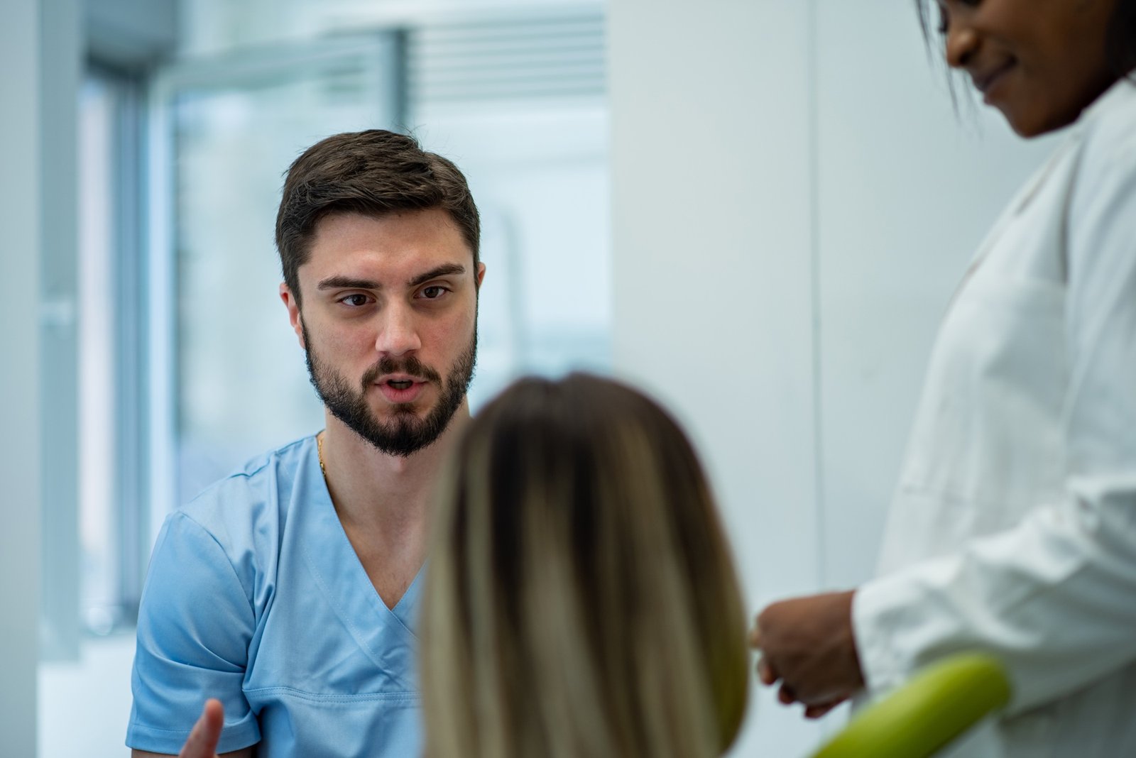 Dentist and patient talking about treatments in a consultation