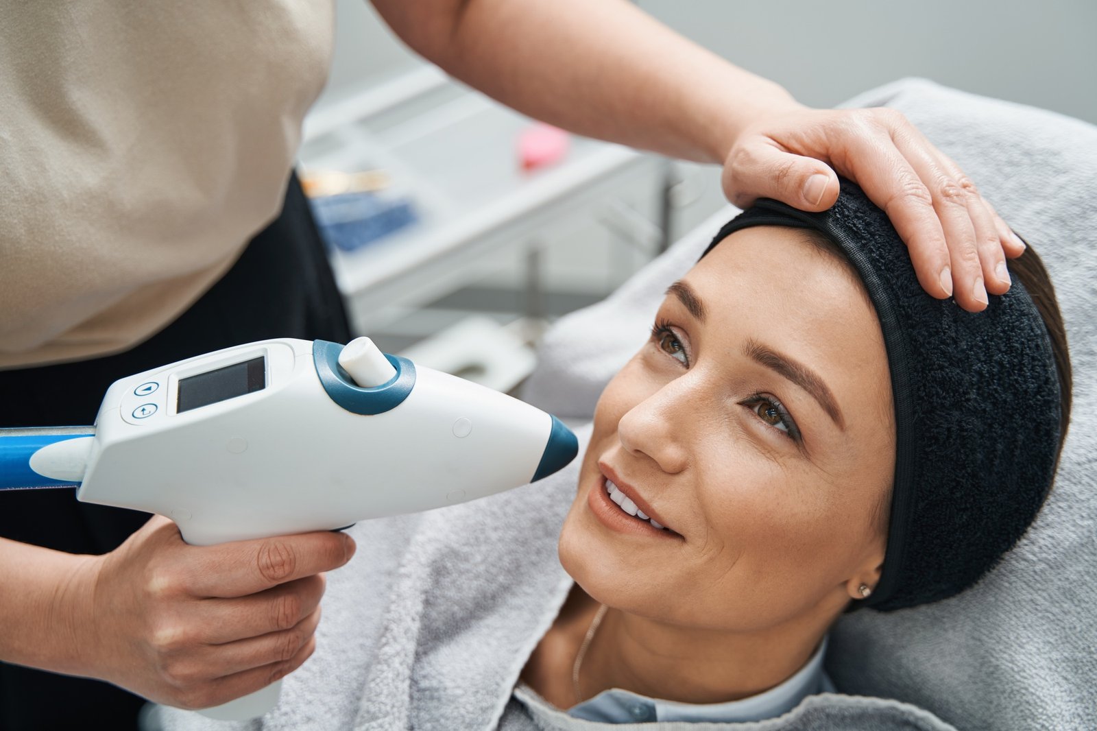 Pleased client undergoing a facial rejuvenation procedure