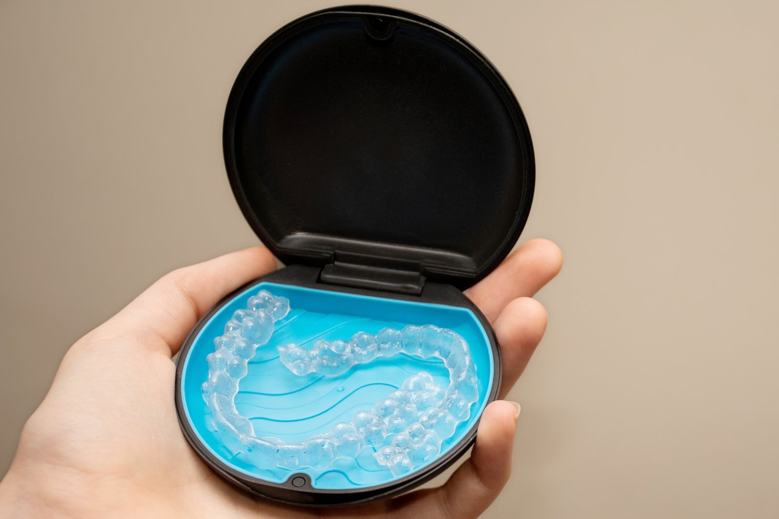 Transparent aligners and storage case. Invisible braces. Clear teeth straighteners. Plastic bracers